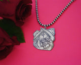 Hand-Carved Turquoise Pendent